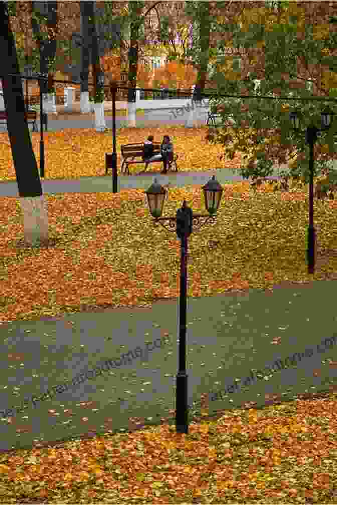 A Person Sitting On A Bench In A Park, Surrounded By Fallen Leaves. Summer S Almost Gone: The Haunting Case Of The Bricca Family Murders