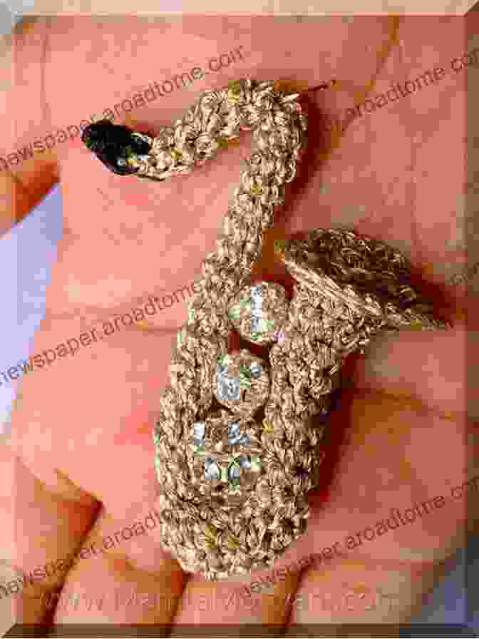 An Exquisitely Crocheted Miniature Saxophone In Vibrant Gold, Showcasing Its Intricate Details And Realistic Form. Miniature Saxophone Crochet Pattern: A Unique Amigurumi For Musical Lovers