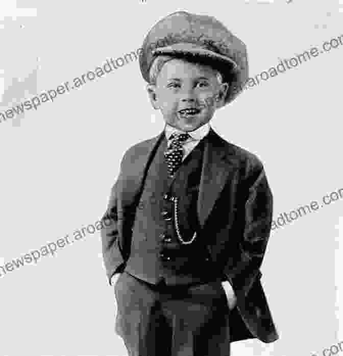 Black And White Photo Of Mickey Rooney As A Child Star, Wearing A Suit And Tie, Smiling The Life And Times Of Mickey Rooney