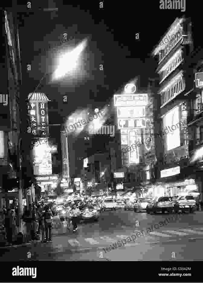 Black And White Photograph Of A Bustling City Street With People Crossing And Buildings Towering In The Distance 2024 Collection Black White Photographs Joseph Fleming