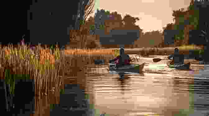 Two Kayakers Paddling Down A Tranquil River, Surrounded By Lush Vegetation And A Clear Blue Sky A Field Guide To British Rivers